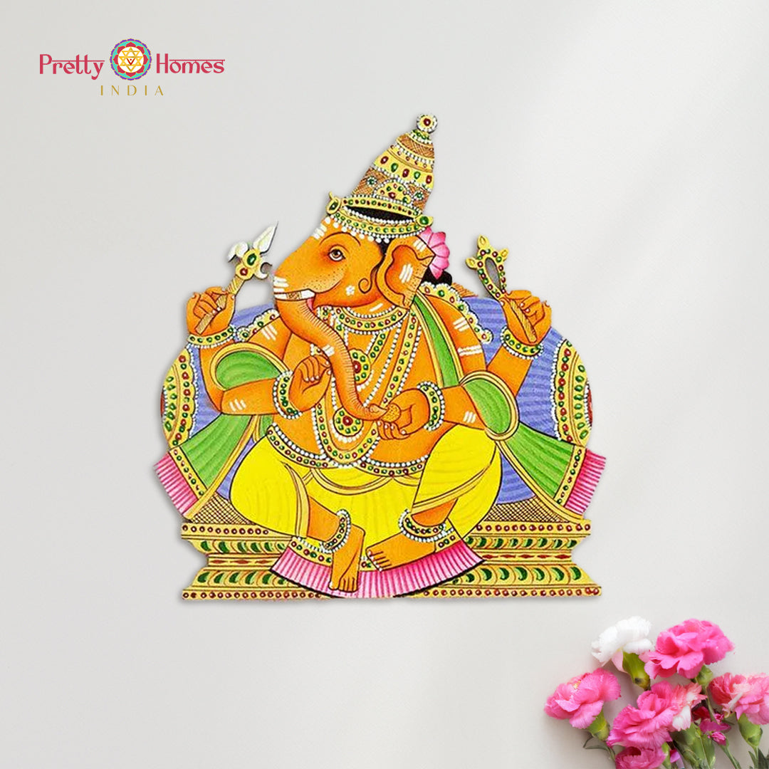 Hand-painted Lord Ganesha cutout in Pichwai style on white background with flowers.