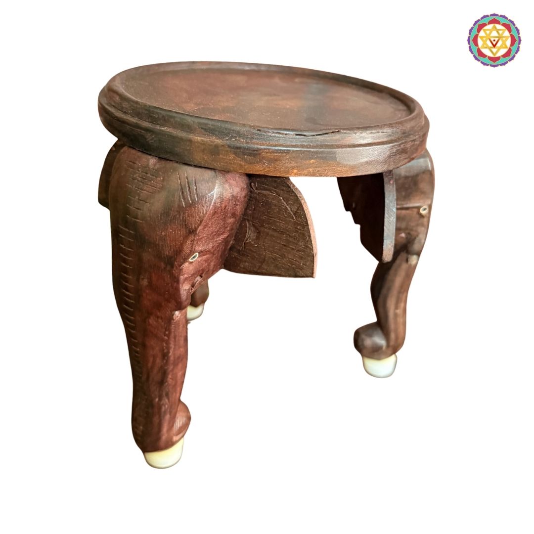 Side view of artisan made wooden elephant stool