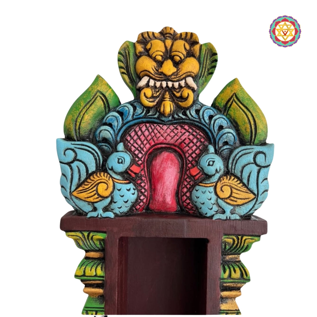 close-up of temple-style wooden pillar carvings on wall shelf