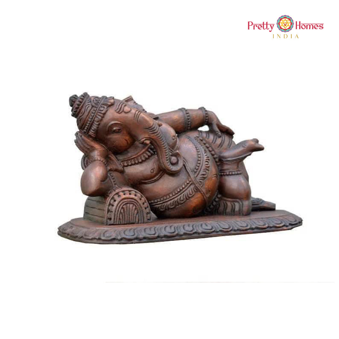 Resting Ganesha sculpture — traditional wood art for Indian homes.