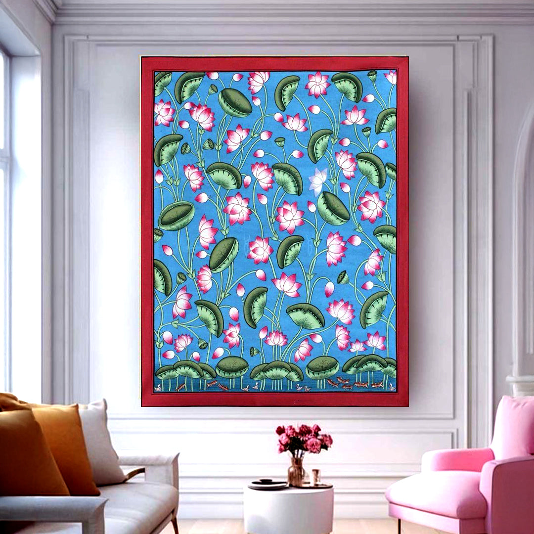 Framed lotus pattern wall art in blue background staged in a modern living room setting