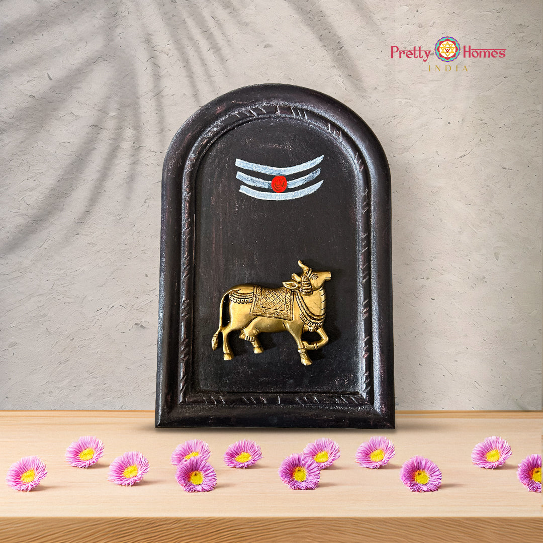 Brass Vishnu symbols shankh chakra framed on carved wooden panel