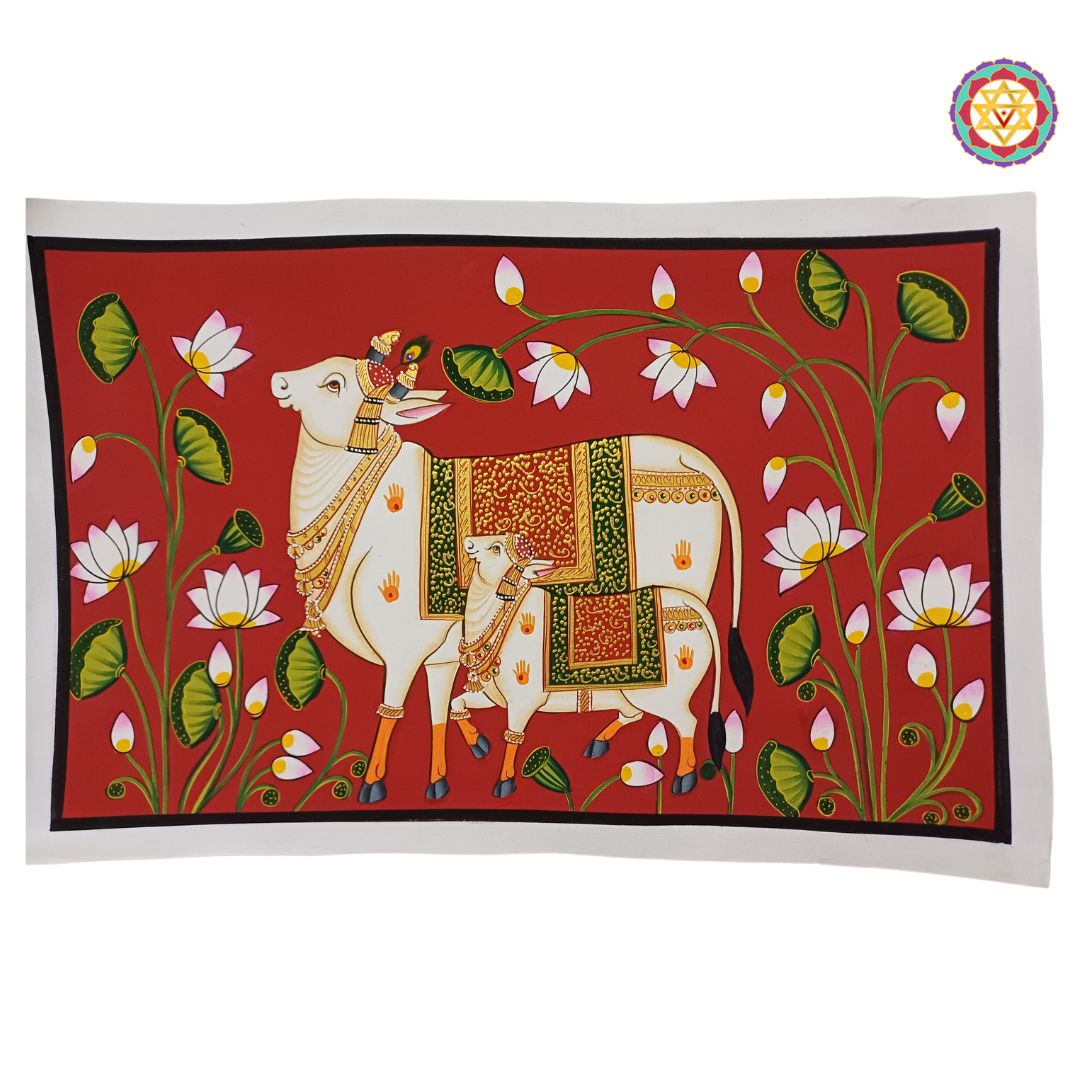 close-up of cow and calf in red pichwai artwork with lotuses