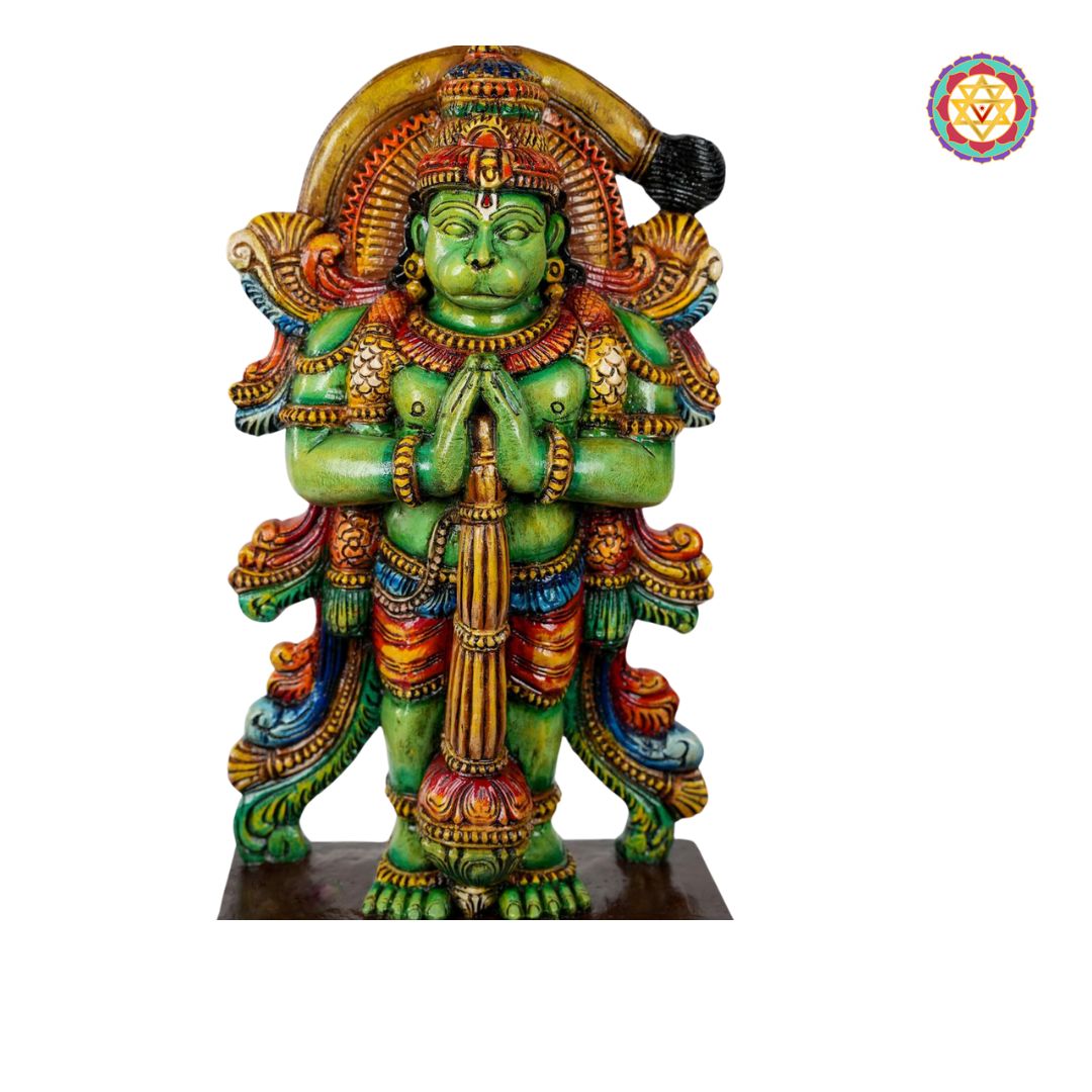 close up of hanuman statue showing carved facial features and weapon detail