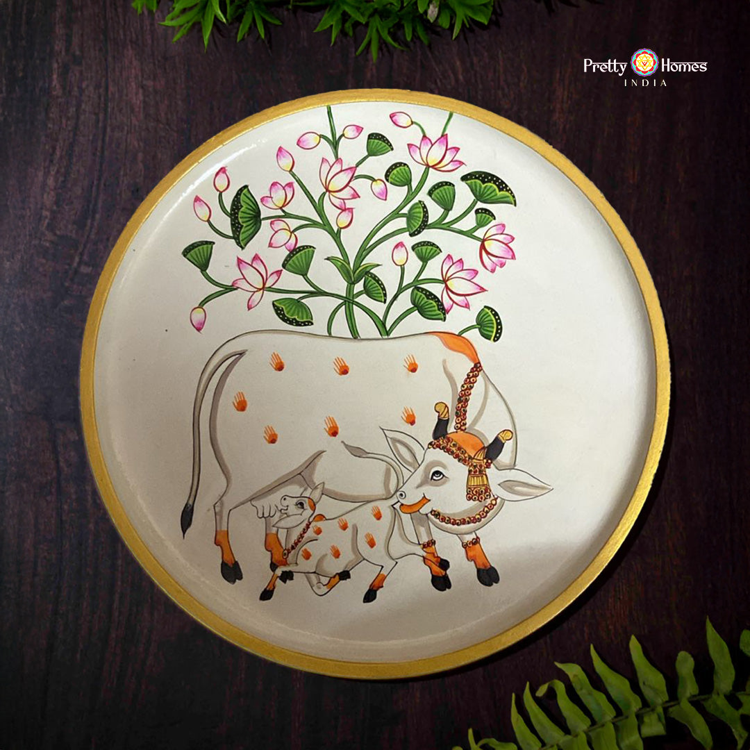 Off white cow and calf pichwai wall plate with lotus blooms