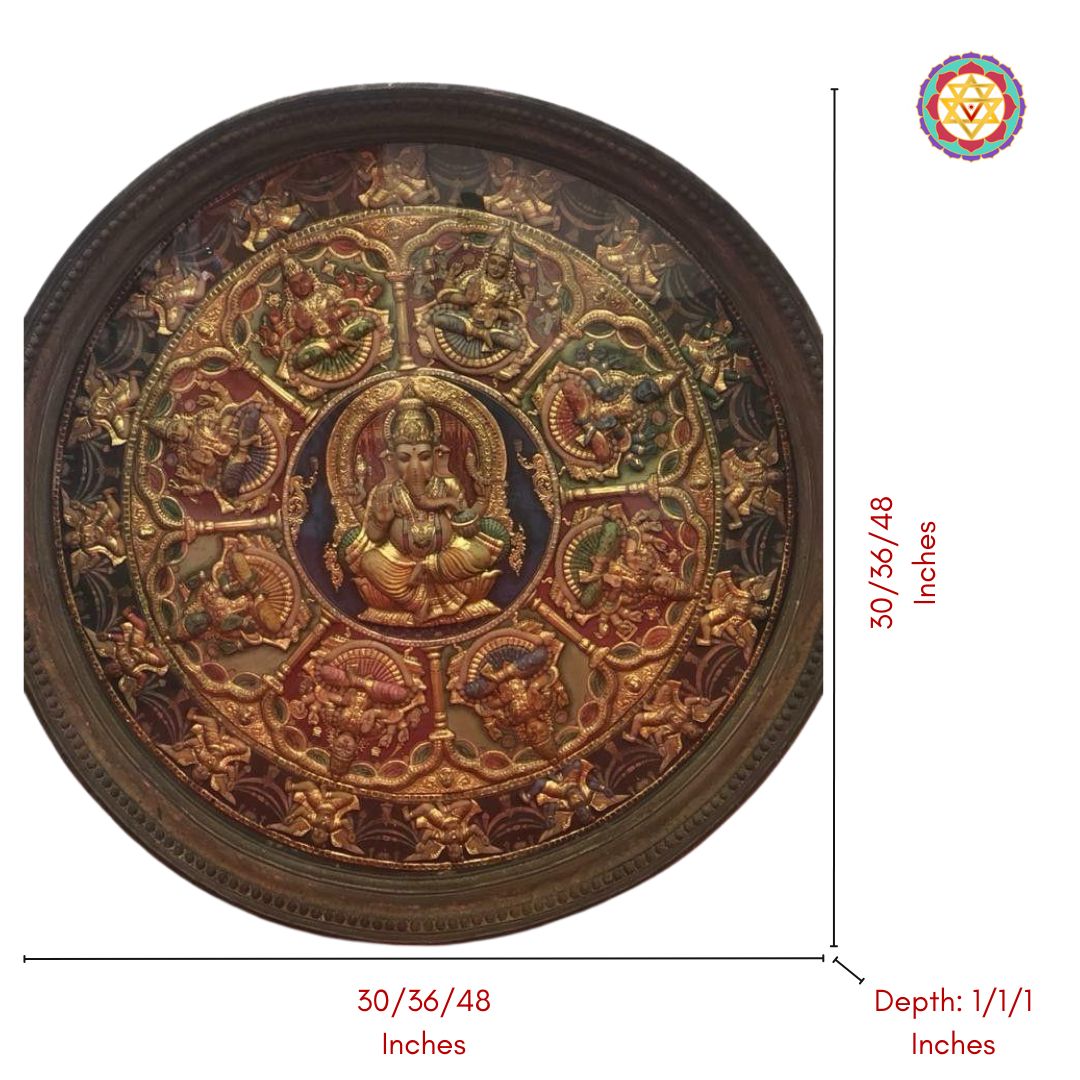 Close-up of antique tanjore art with gold foil and divine figures