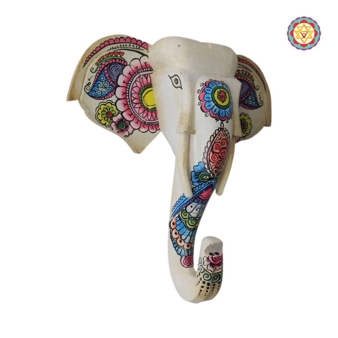 Close-up of wooden elephant wall decor showing painted textures
