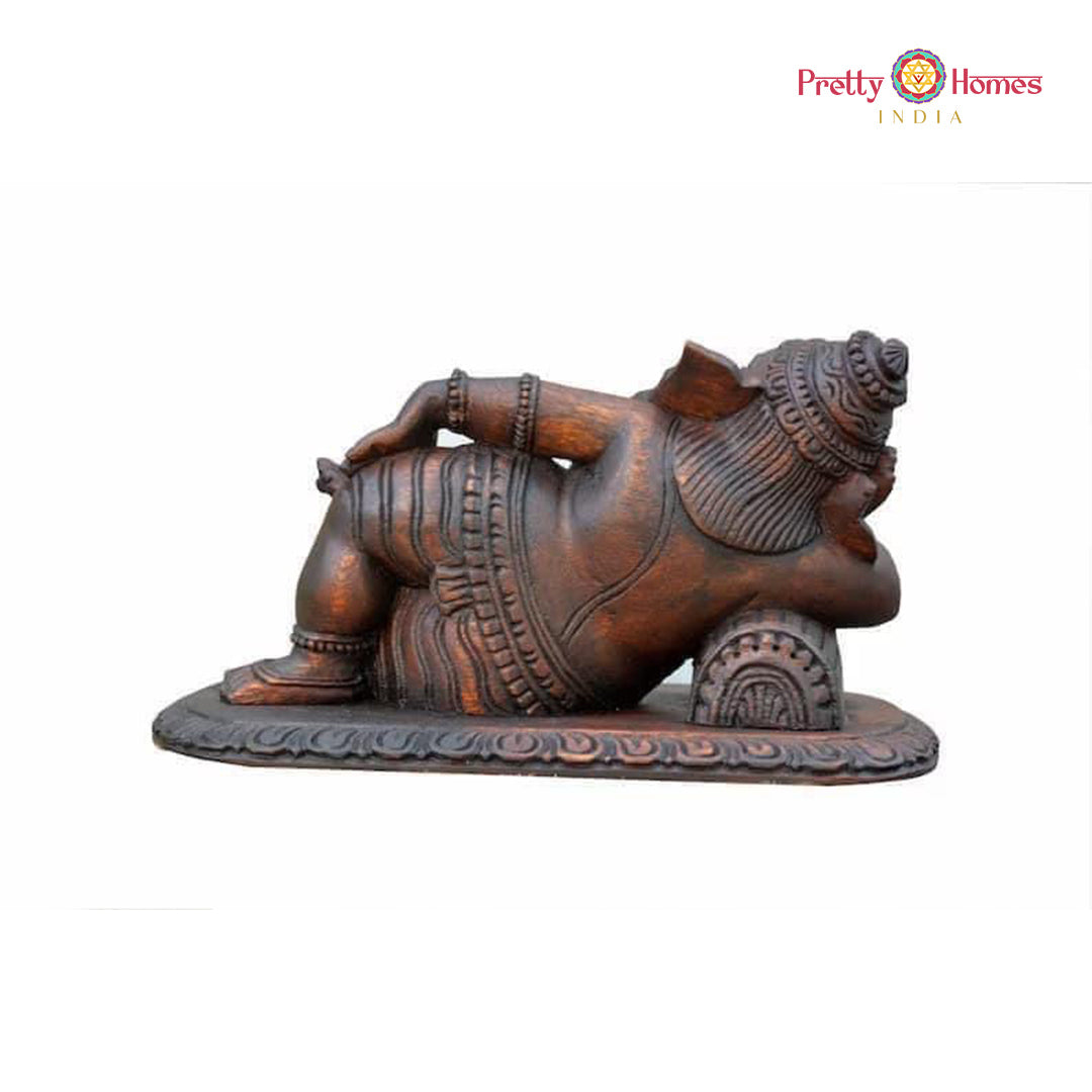 Ganesha reclining panel — artisan-made wooden temple-style decor.