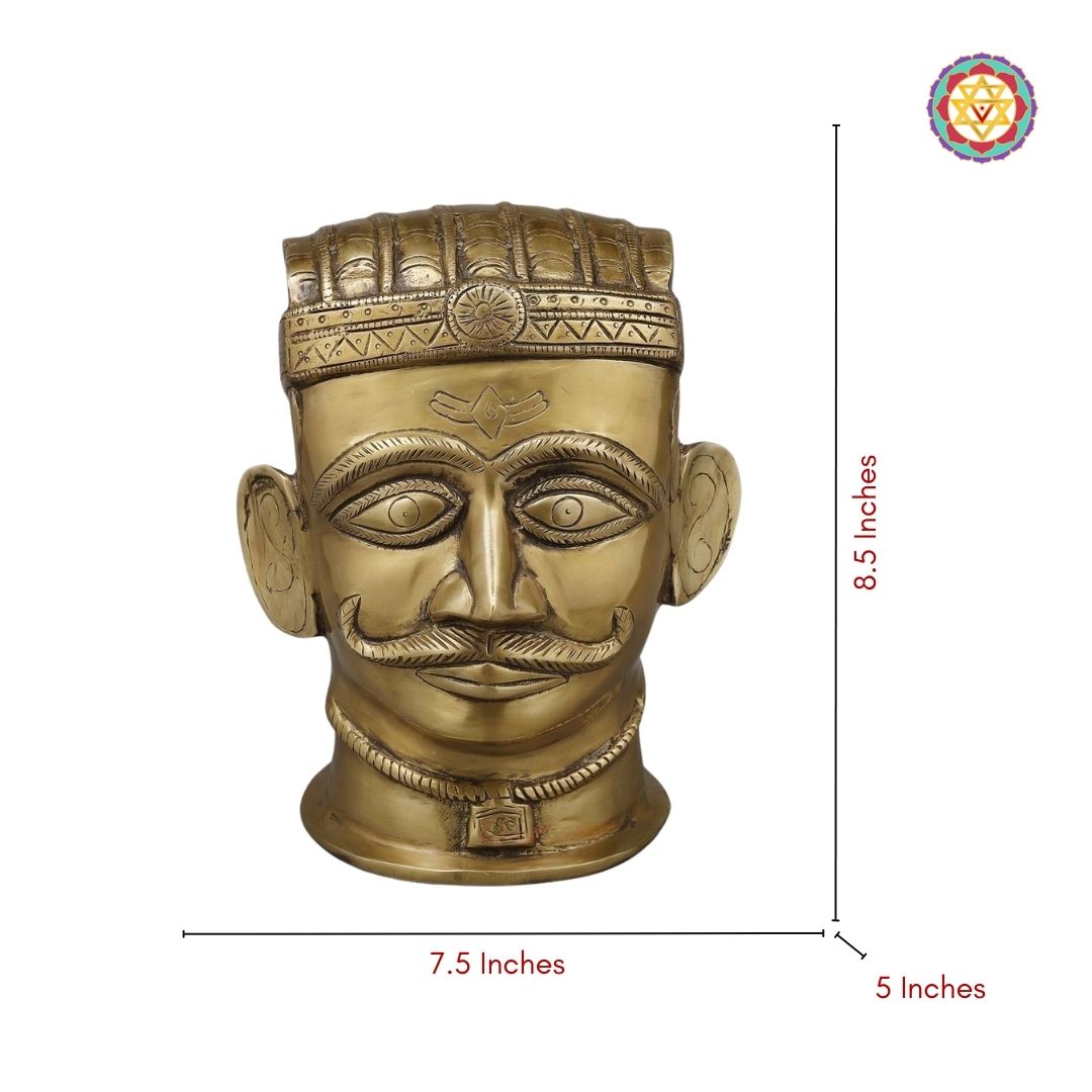 profile view of Shiva brass face showing sharp features and artisanal work