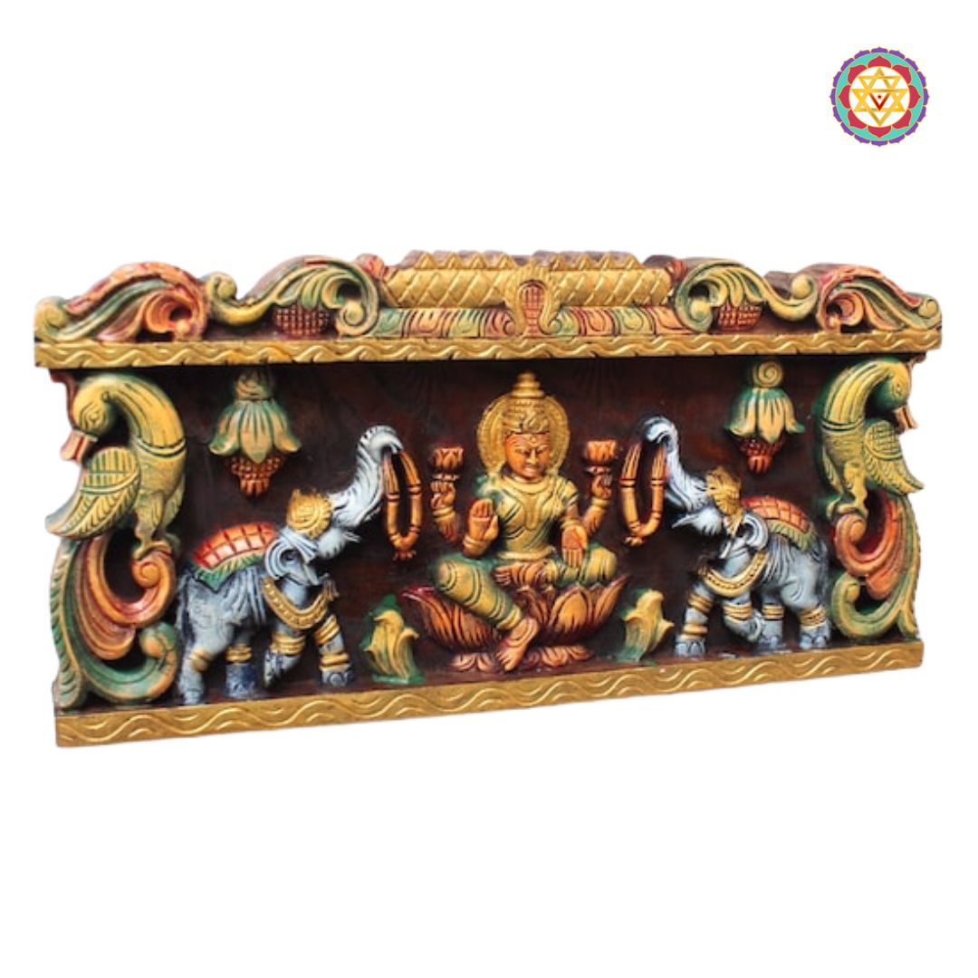 handcarved gajalakshmi panel angled view highlighting divine detailing