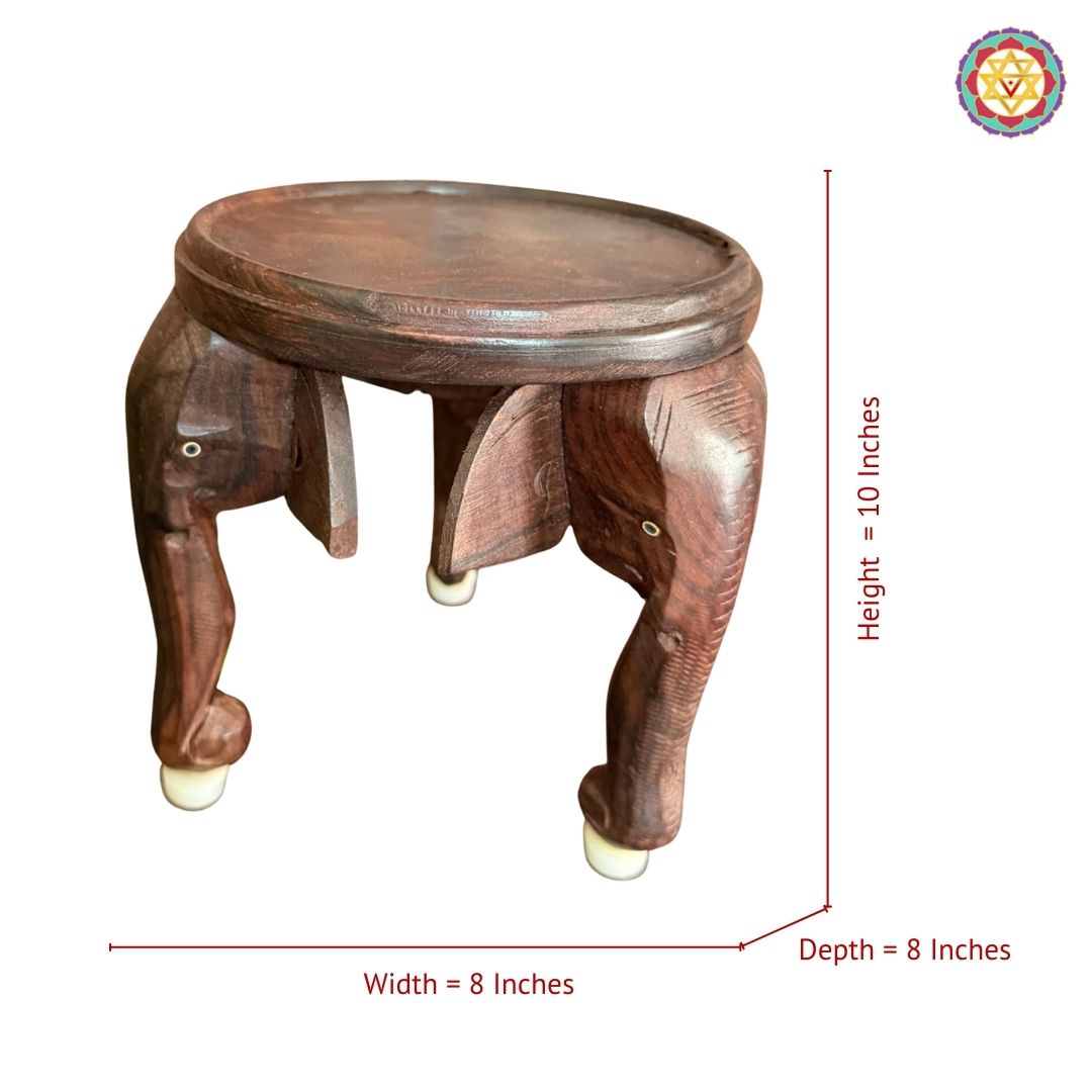 Top angle of artisan wooden elephant stool showing carving