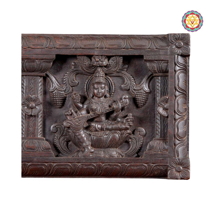 Full frontal view of carved wooden wall panel – Ganesh, Lakshmi, Saraswati
