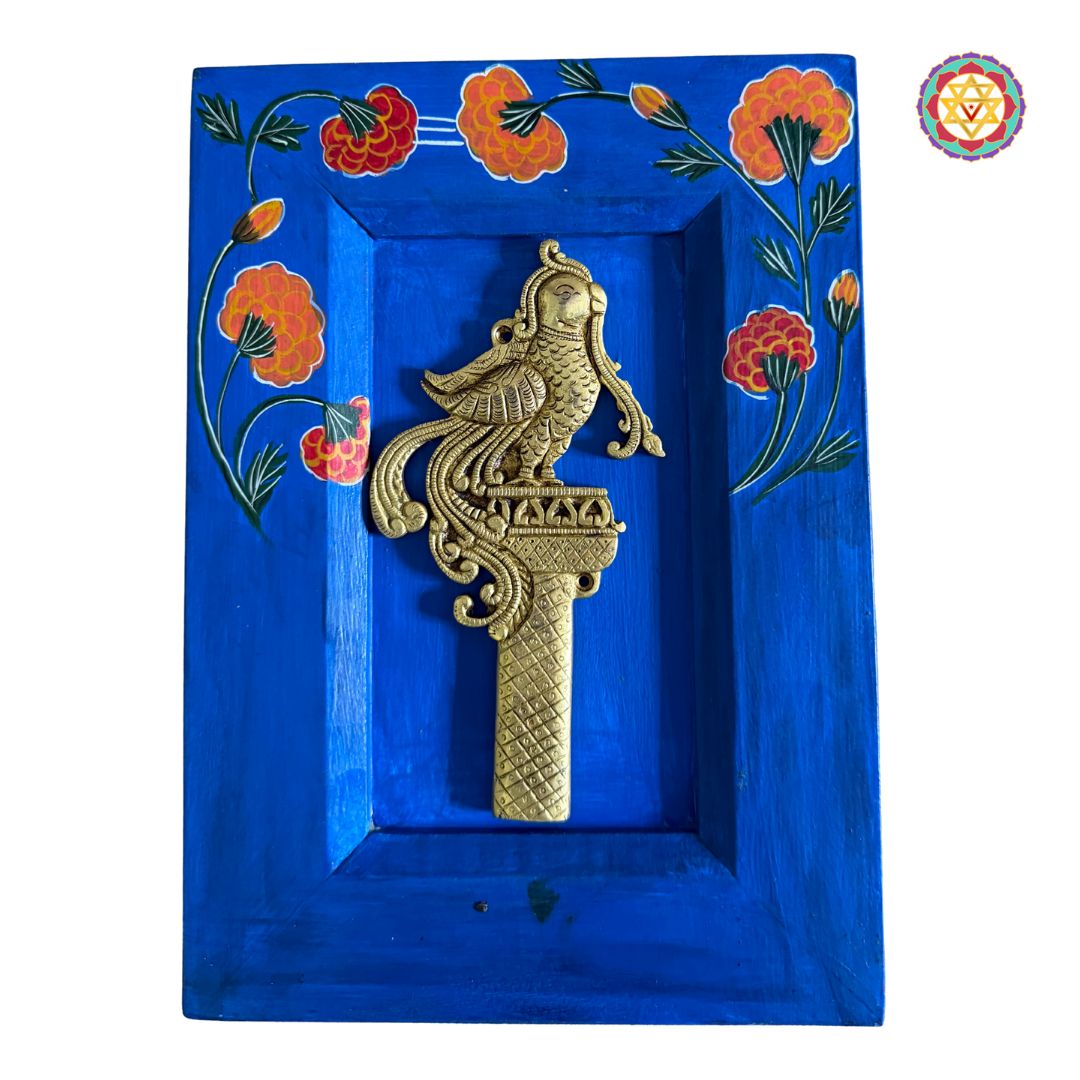 angled shot highlighting brass texture and painted motifs