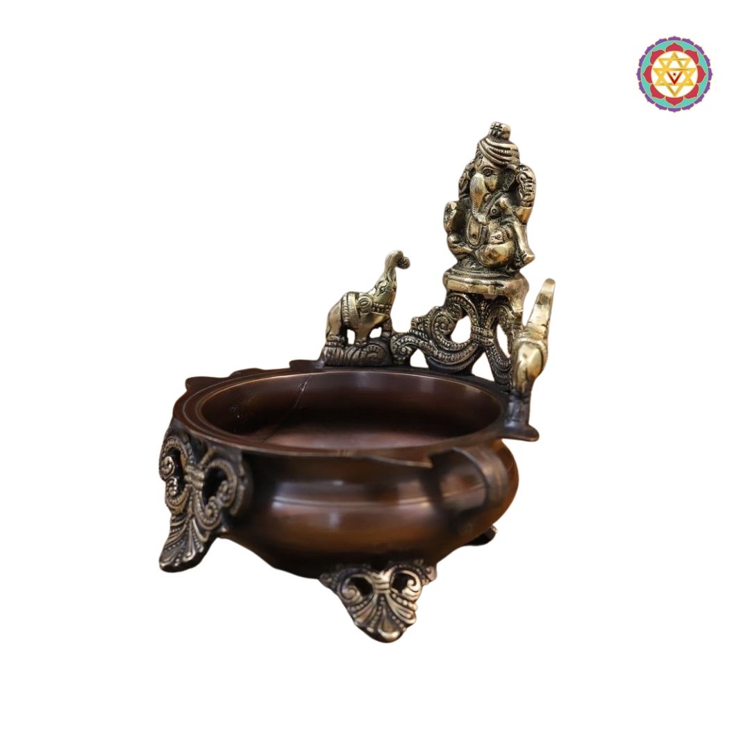 top-angle view of Ganesh urli bowl with textured copper surface