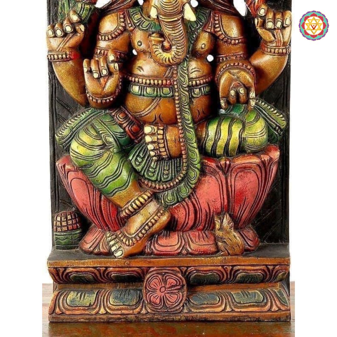 Close-up of Ganesha face and crown — fine detailing in teak wood with antique gold polish finish