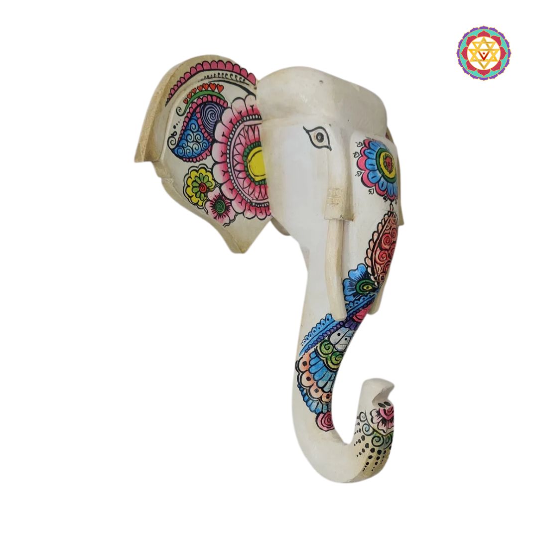 Side profile of blue elephant wall art with carved detailing
