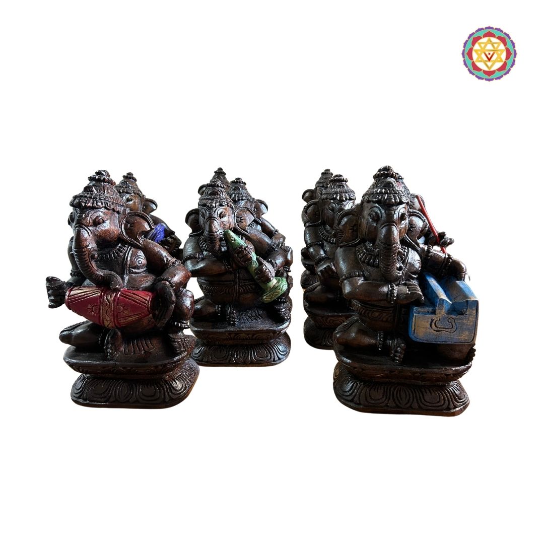 Artistic hand-painted wooden Ganesh statues in musical postures for décor