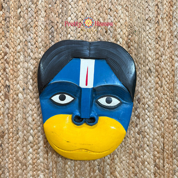 Close-up of Hanuman mask expression and carving detail