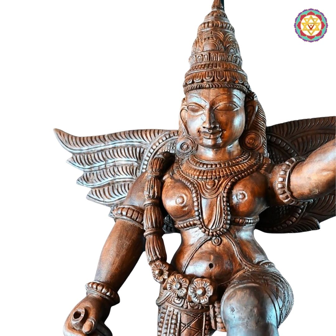 Side angle of Garuda wooden sculpture showing carved wings and details