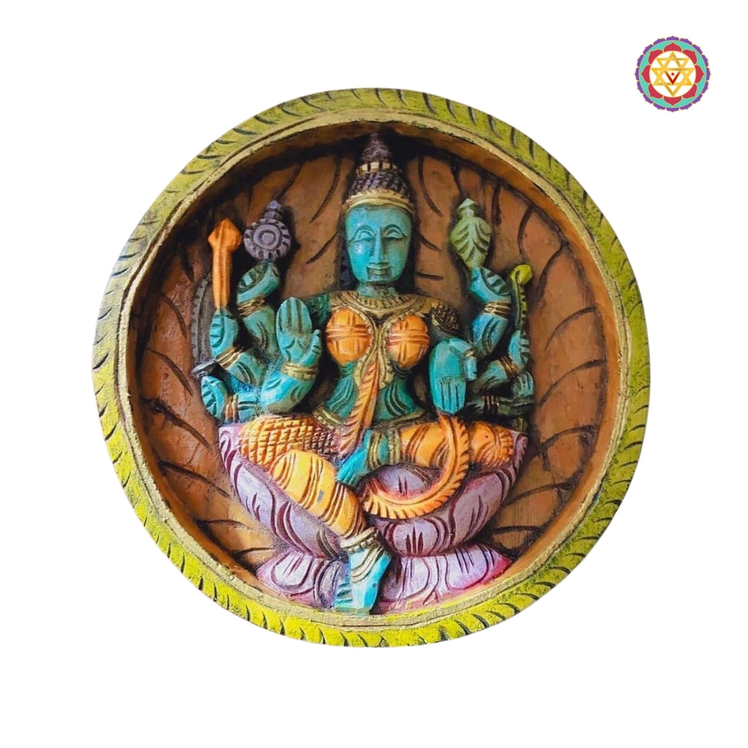 Vijaya Lakshmi wooden wall panel with conch, discus, and posture of triumph