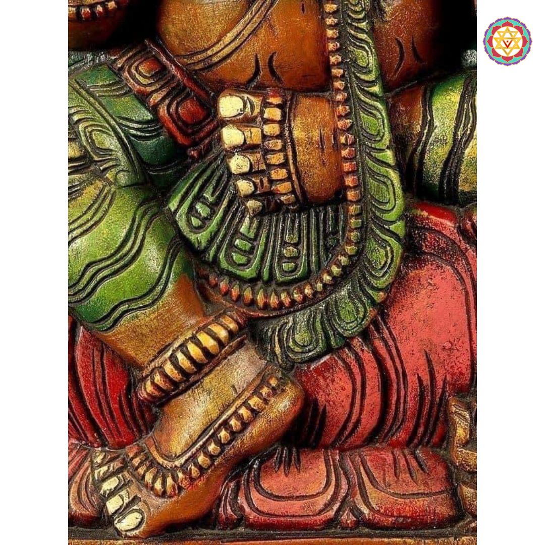Side view of seated Ganesha under canopy — smooth carving and layered prabhavali detailing, traditional art decor