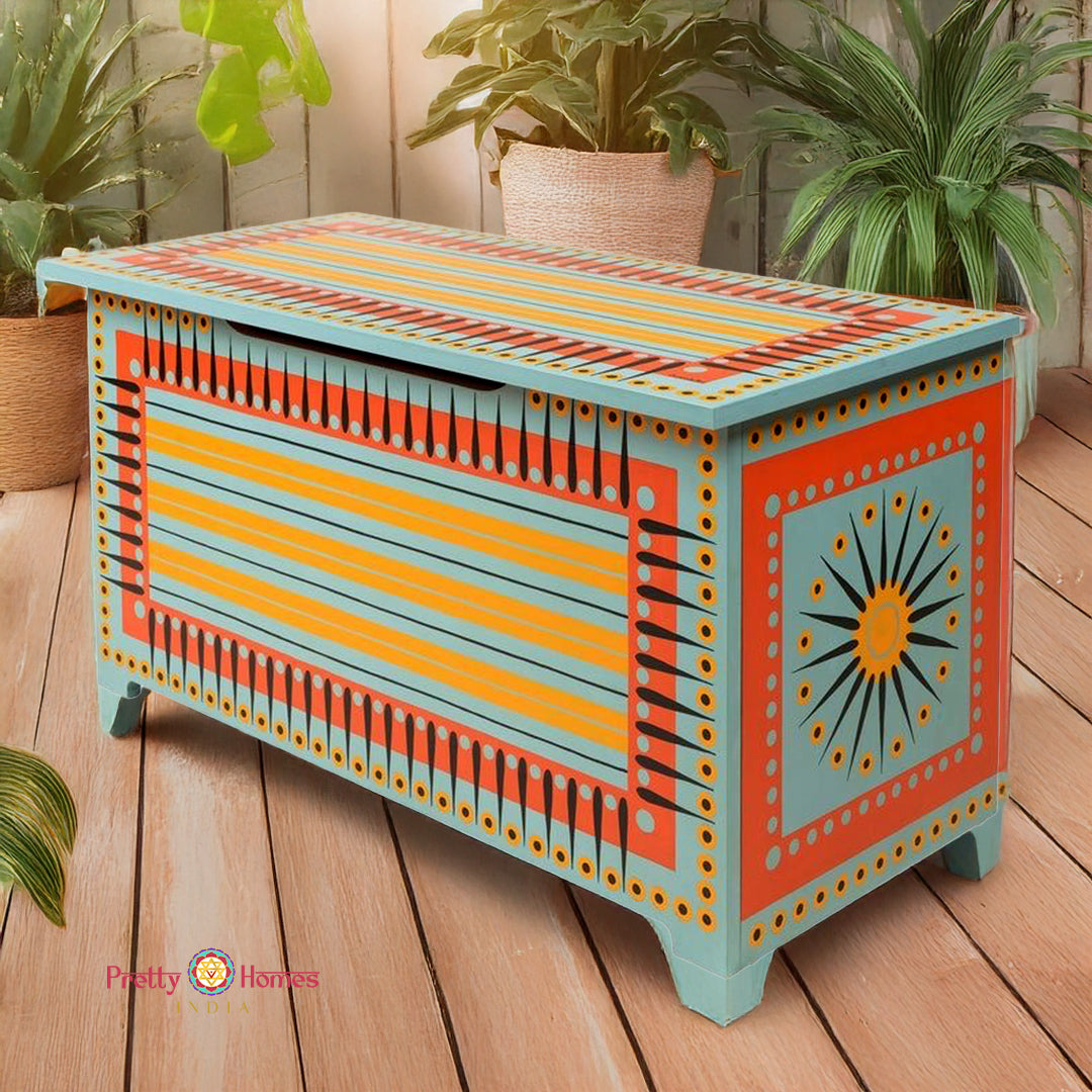 Wooden trunk angled view showing painted top and metal fittings