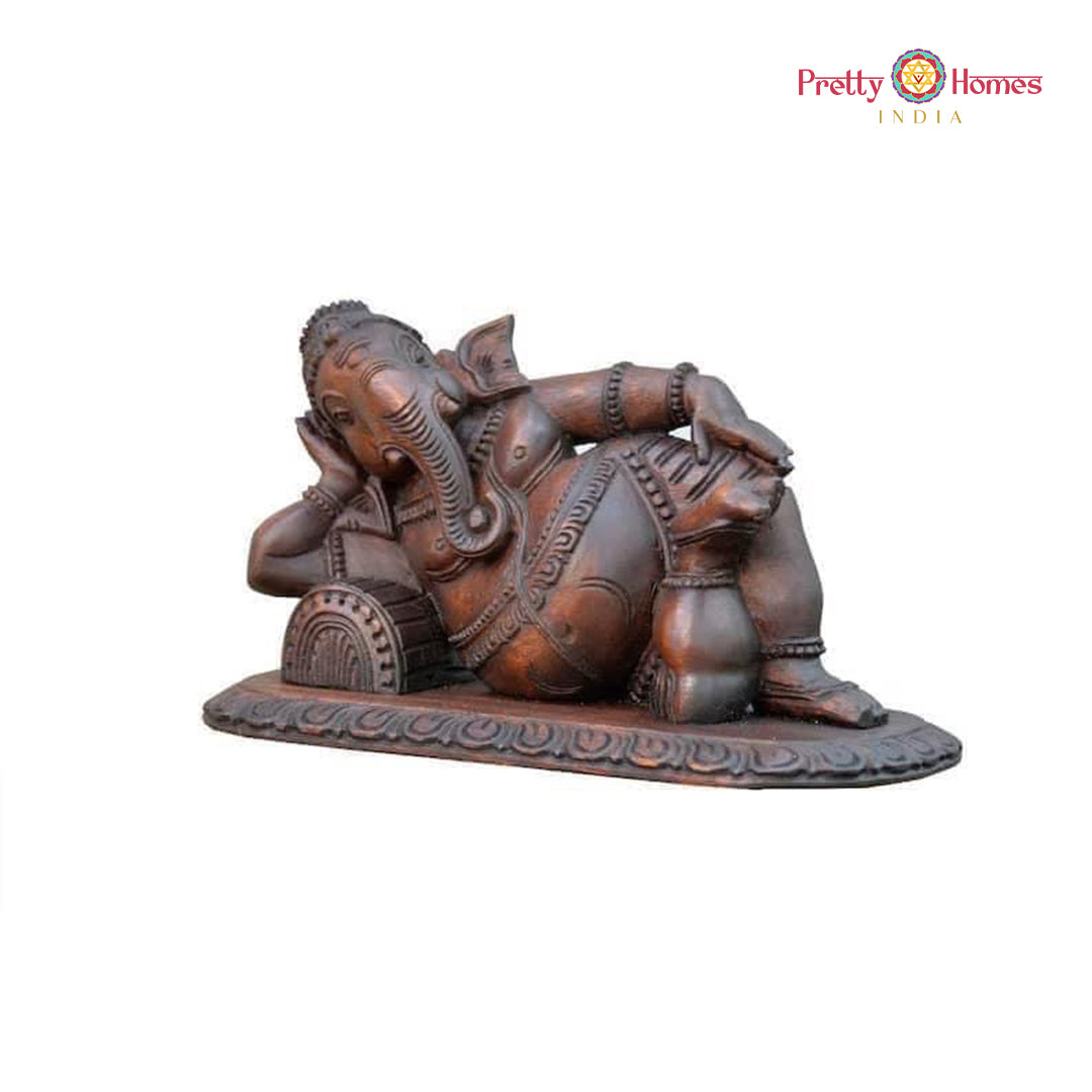 Handcarved wooden Ganesha — antique-style resting figure wall art.