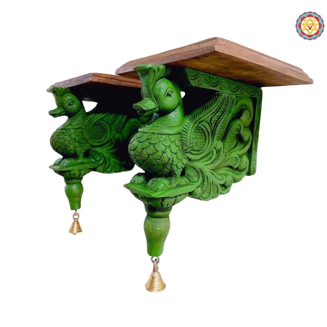 Side profile of wooden annam wall bracket showing intricate curves and handcarved motifs