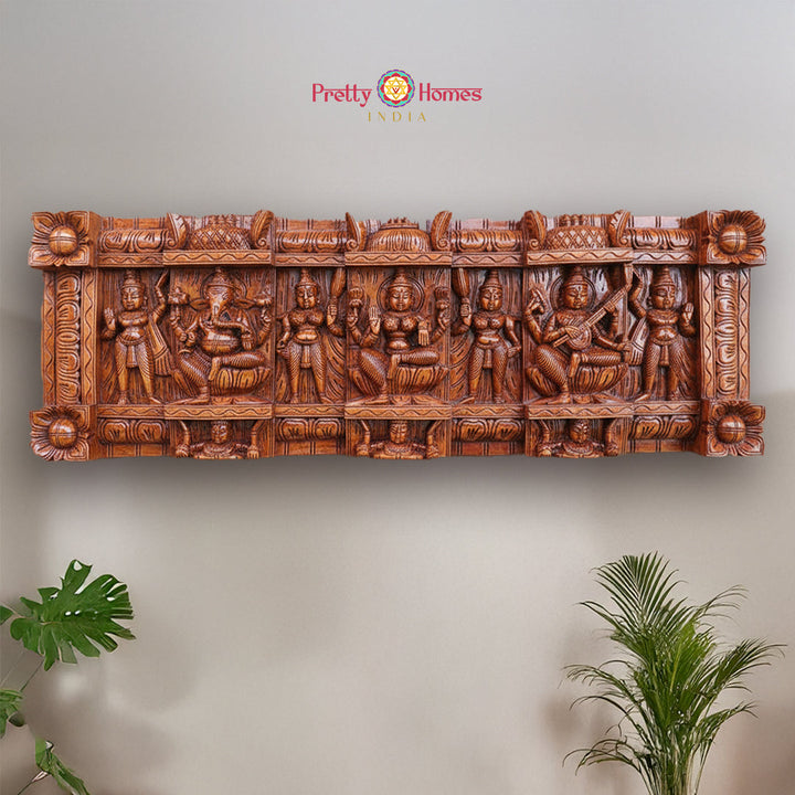Vintage wood carved panel of Lord Ganesha Lakshmi and Saraswati with worshippers