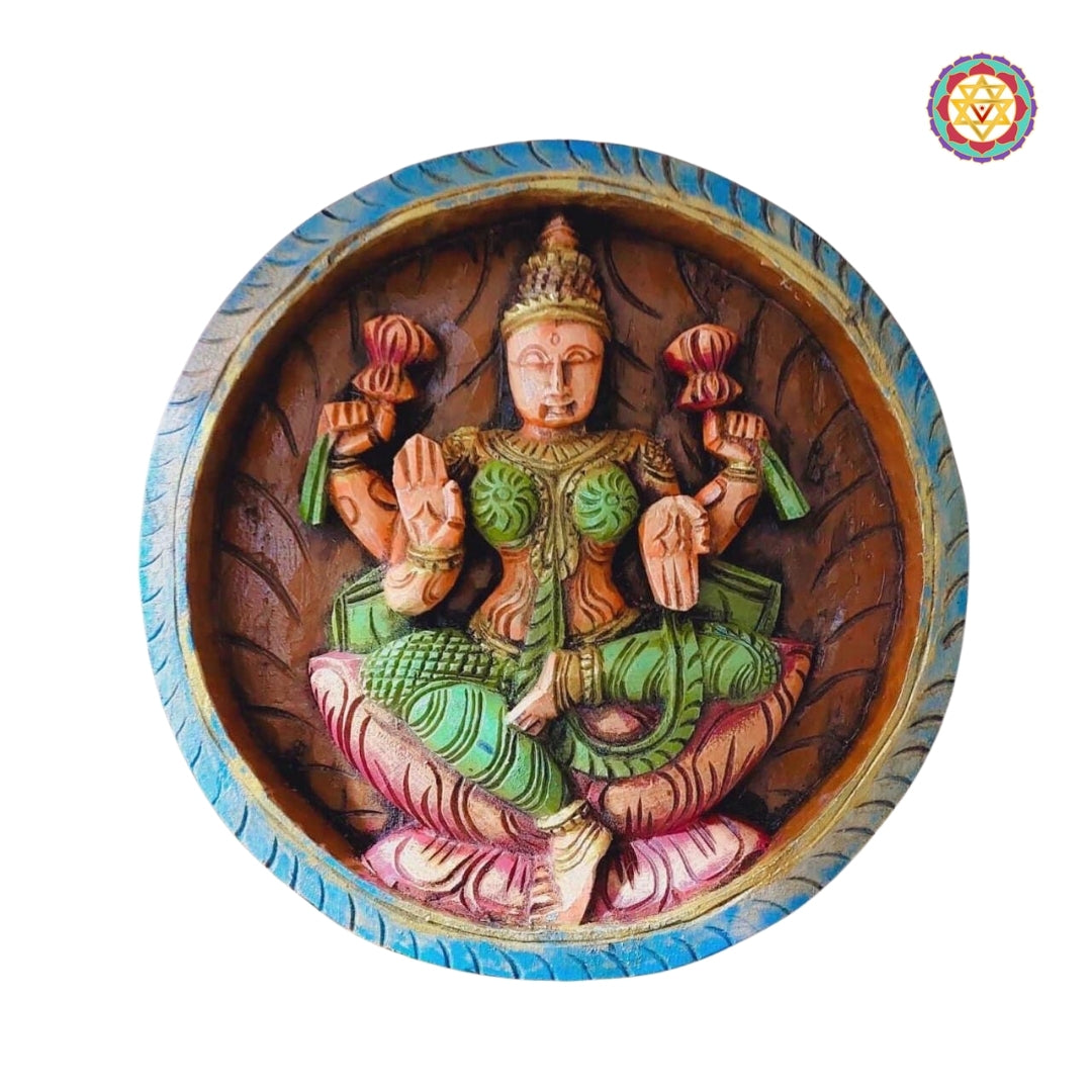 Vidya Lakshmi carved wooden panel with scriptures, seated in meditative teaching posture