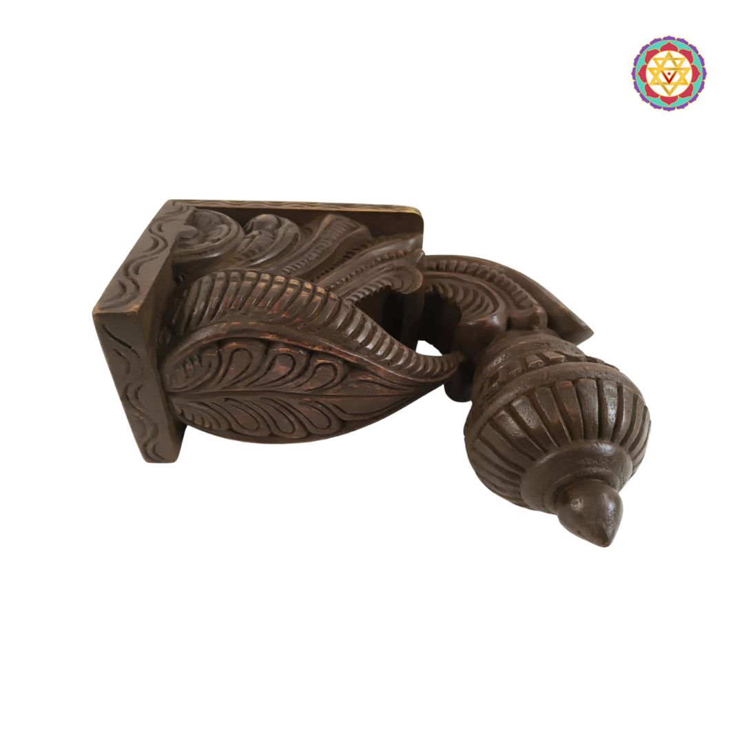 “Handcarved wooden wall bracket in Chettinad Bodhil design”