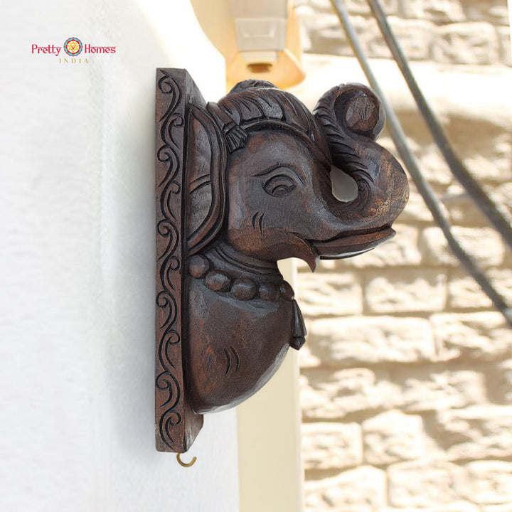 Hand carved teak elephant wall bracket