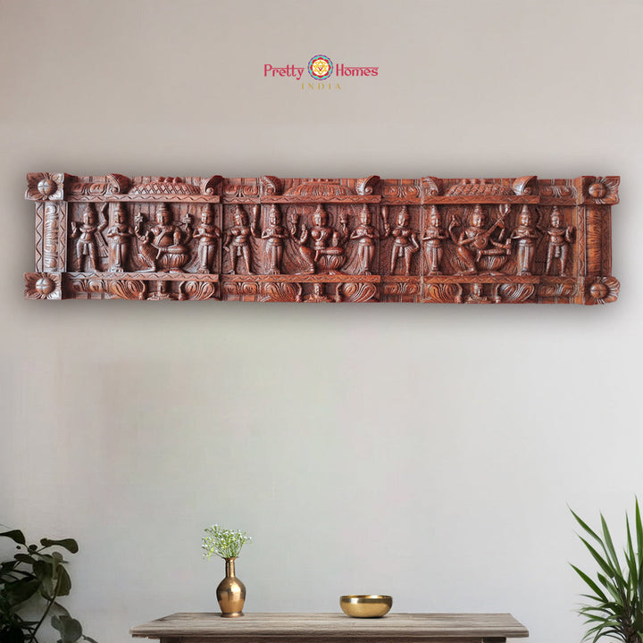 Vintage horizontal wood carved panel featuring multiple feminine divine deities