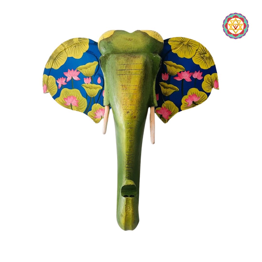Close-up of elephant wall decor showing carved features and floral art