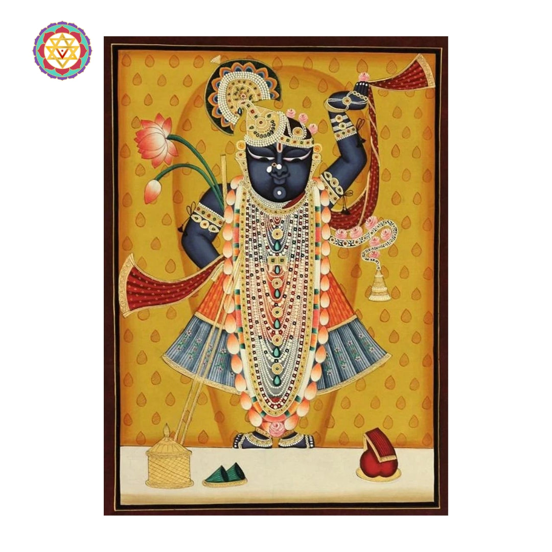Traditional Pichwai painting in deep reds and blues showcasing devotional themes around Krishna
