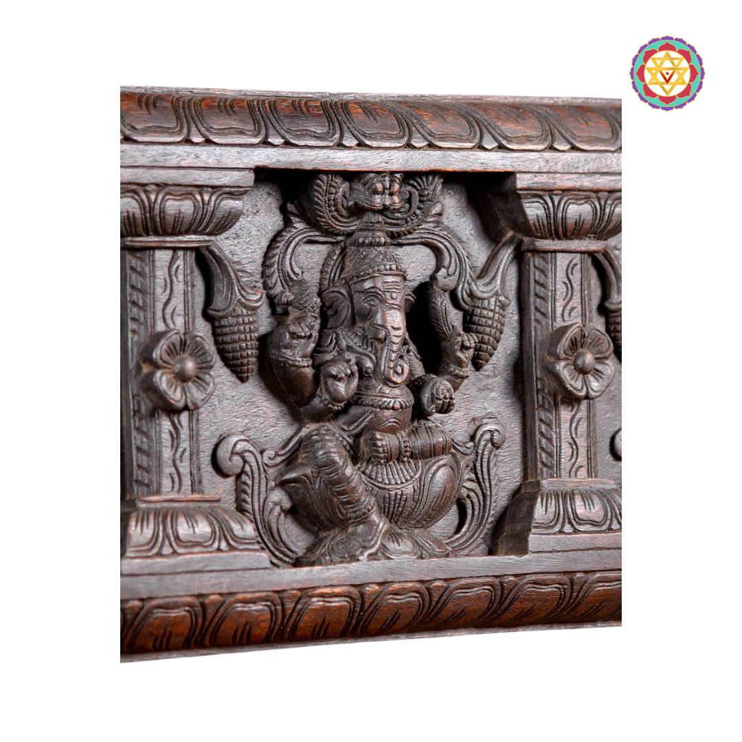 Close-up of Ganesh carving on decorative wood panel