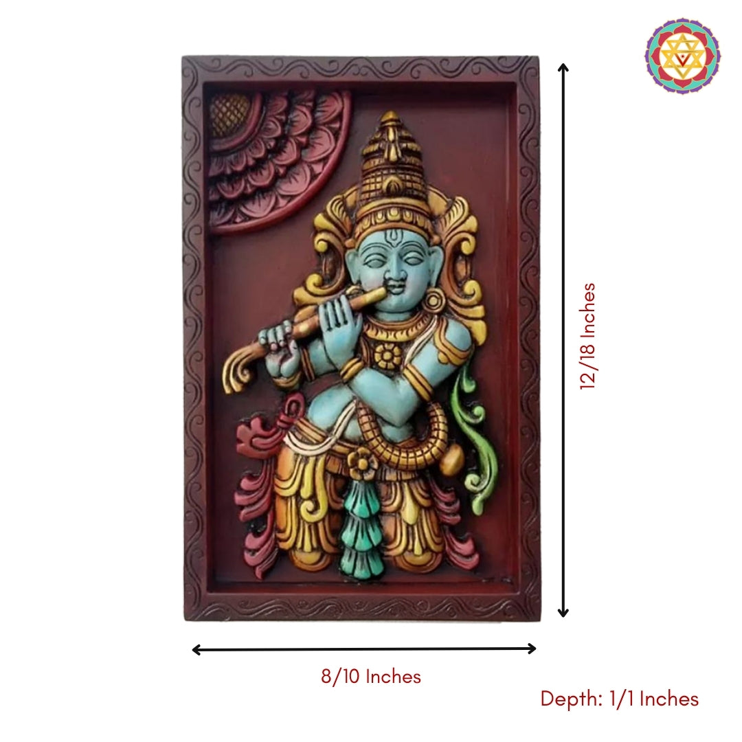 Close-up of fluting Krishna wall frame showing fine detailing on flute, attire, and halo carvings