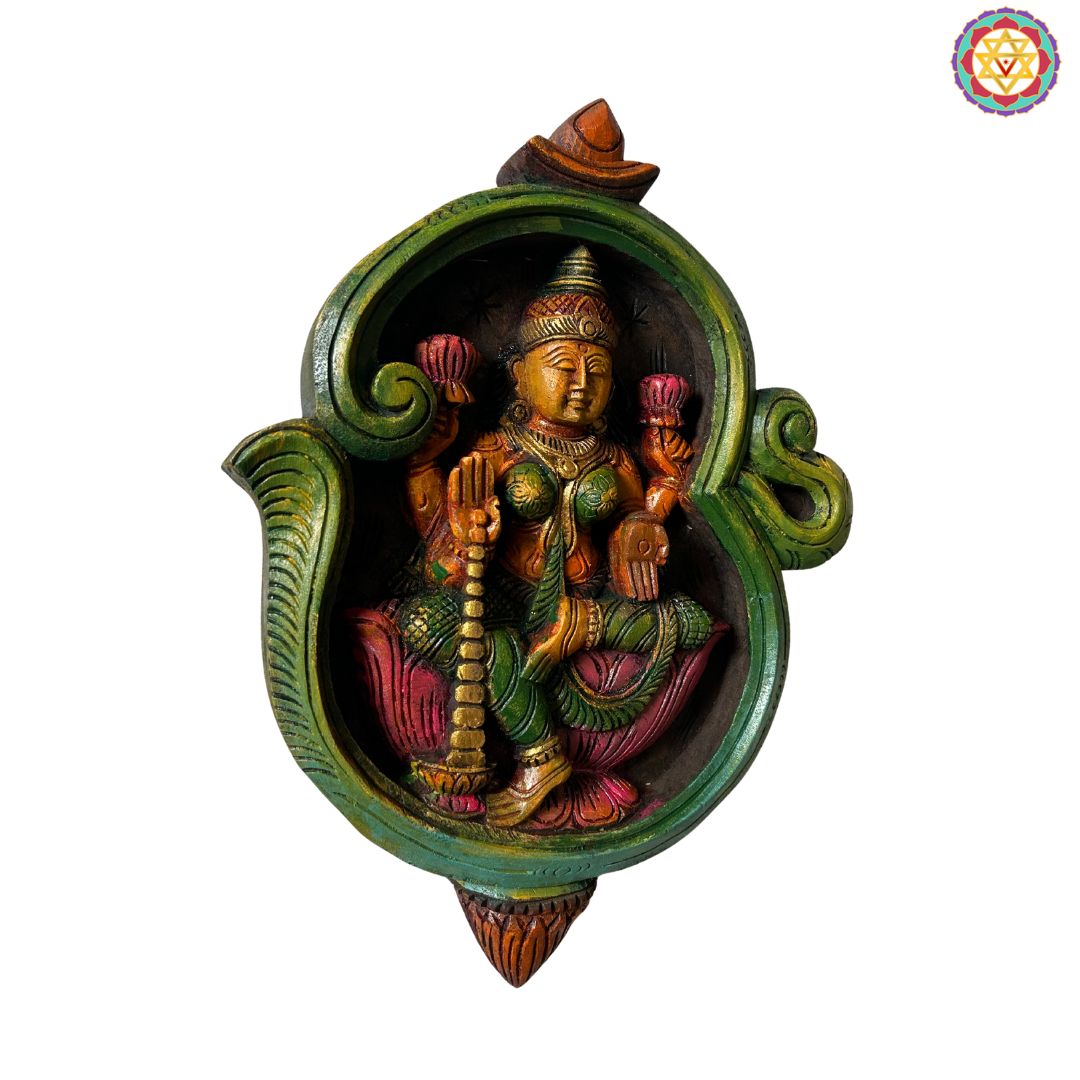 close up dhanlaxmi om frame showing fine carving and detailing