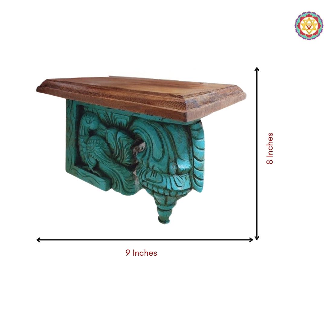 Angled shot of wooden bodhil bracket with swan annam carving showing elegant floral scrollwork