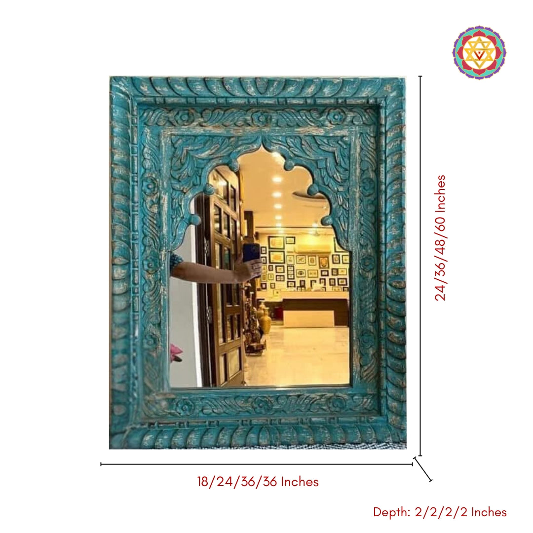 Handcrafted wooden Jharokha mirror in rustic turquoise finish, styled with brass decor elements.”