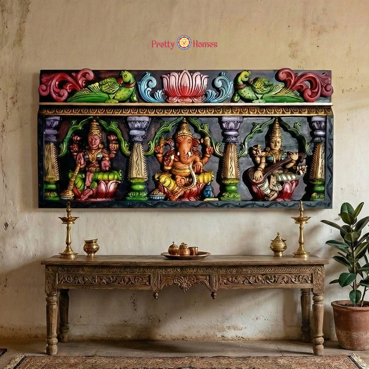 Hand carved Ganesha Lakshmi Saraswati wooden wall panel with lotus motifs parrots and traditional temple decor