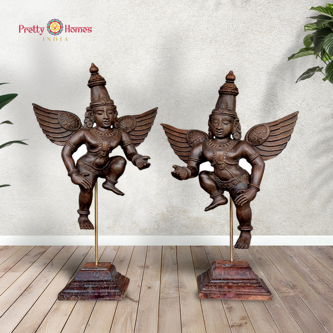 Pair of hand-carved wooden Gandharva (Indian angel) tabletop sculptures on brass stands — antique brown finish, decorative home accent
