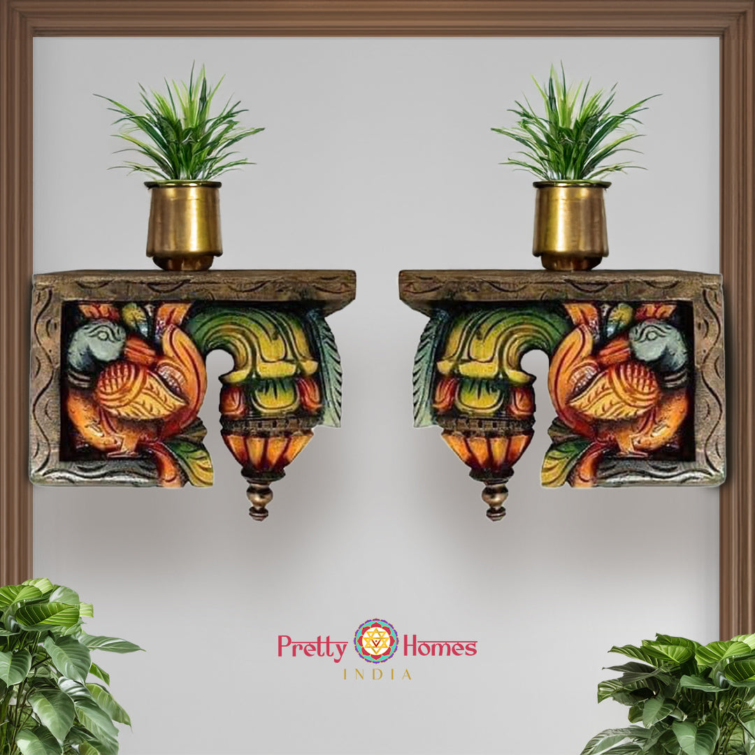 Front view of wooden bodhil bracket showing carved annam swan motifs with floral patterns