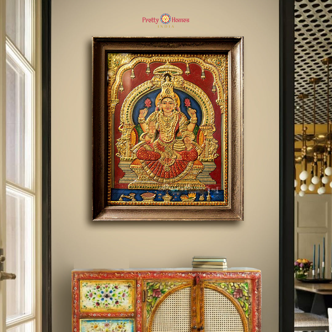 vintage style dhan laxmi tanjore painting with gold foil and ornate wooden frame