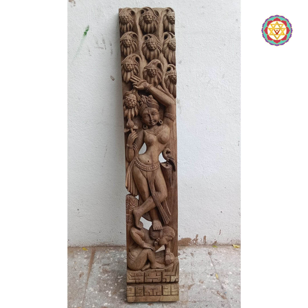 Close-up of Khajuraho-style apsara carving on vertical wooden panel