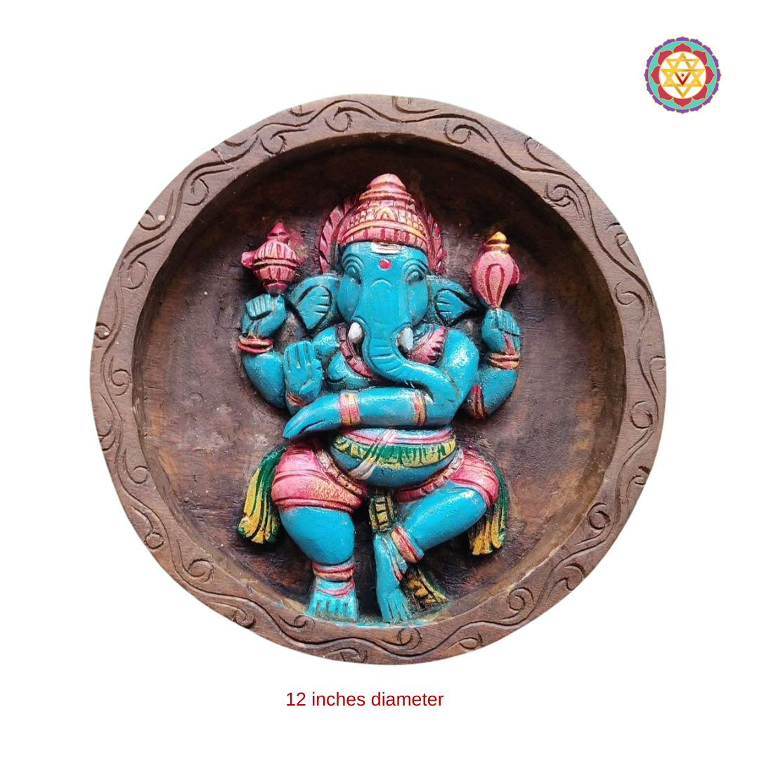 detailed close-up of dancing ganesha carving showing intricate hand-tool marks and aged wood polish