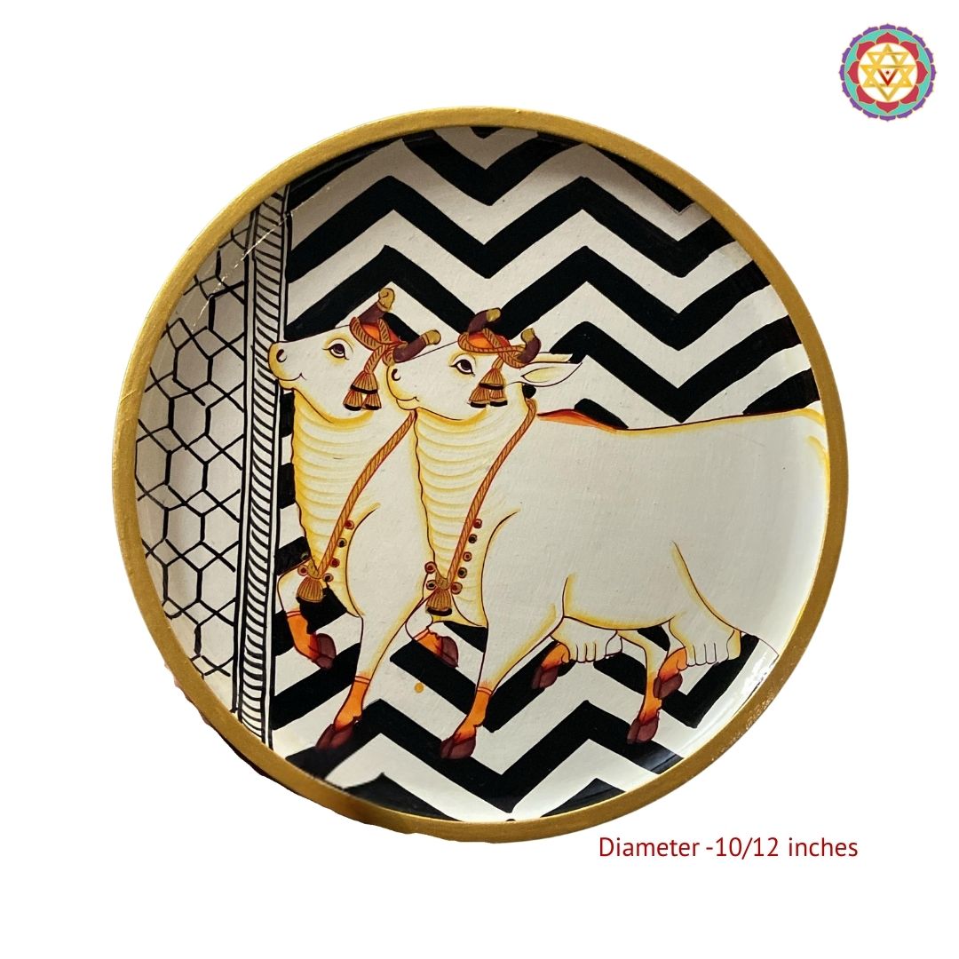 Close view of geometric pattern cows painted on pichwai wall plate