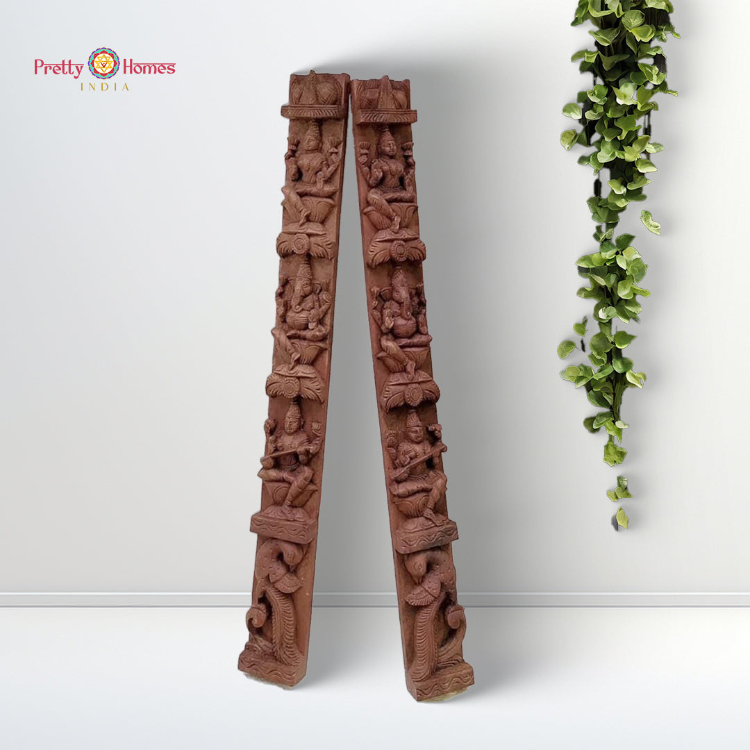 wooden wall hanging featuring twin apsaras playing musical instruments