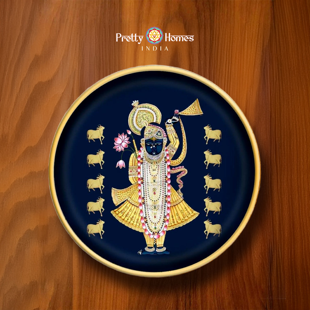 Shrinathji pichwai painting on 12-inch wall plate with golden cows and dark blue background. Ideal for pichwai home decor.