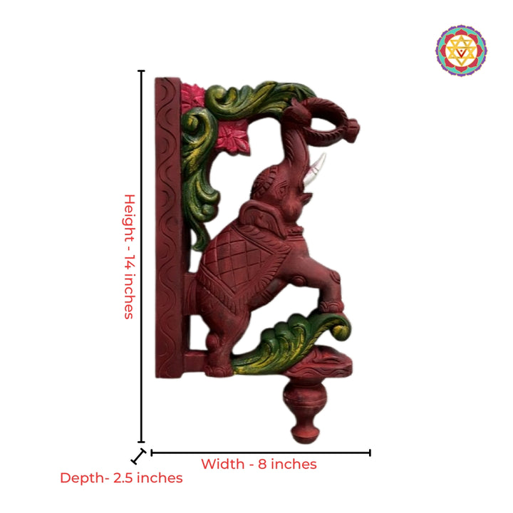 Intricate wood carving of elephant bracket with floral design